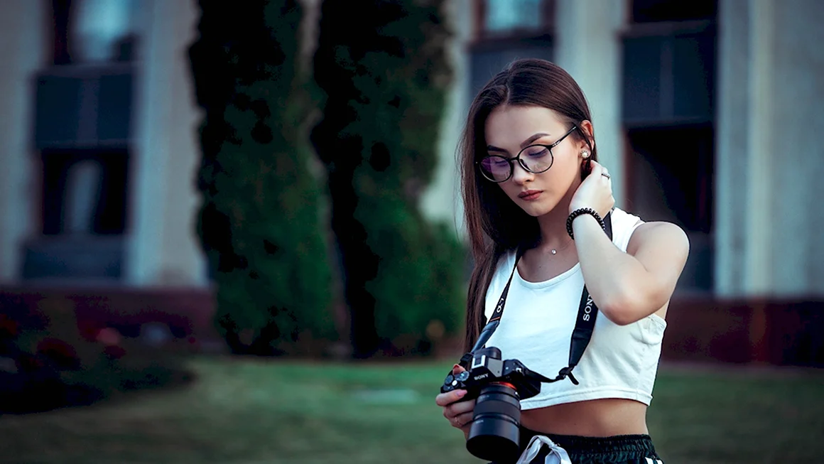 Девушка с фотоаппаратом
