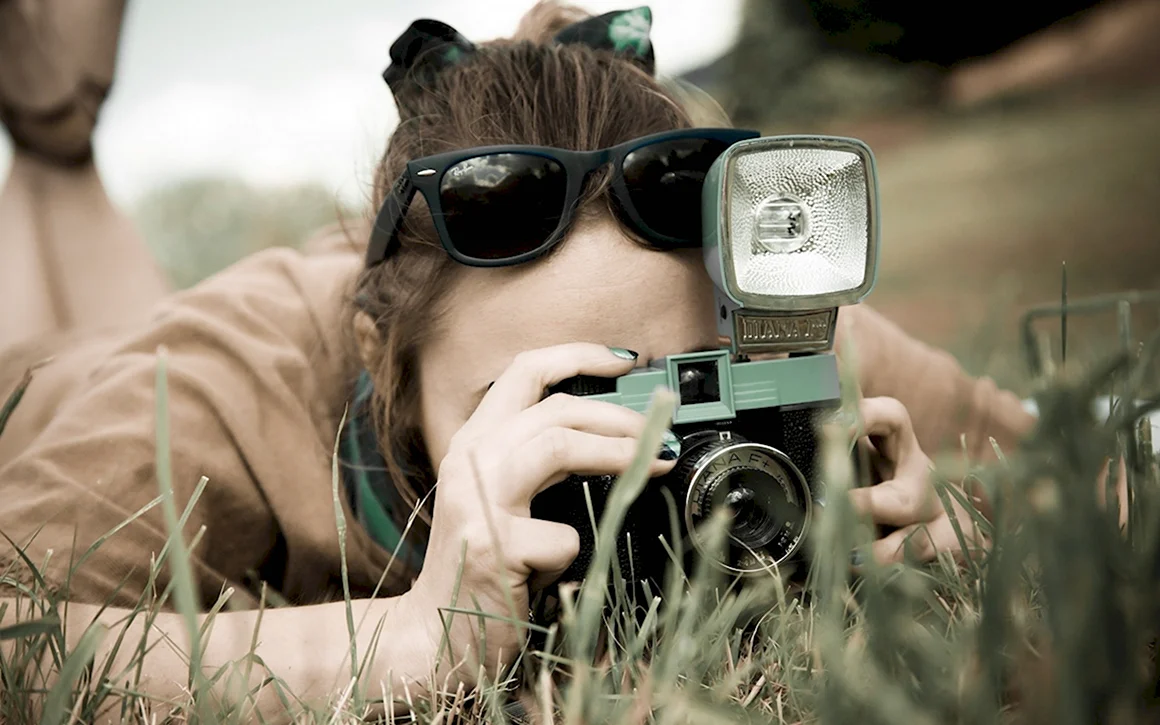 Фотограф девушка с фотоаппаратом